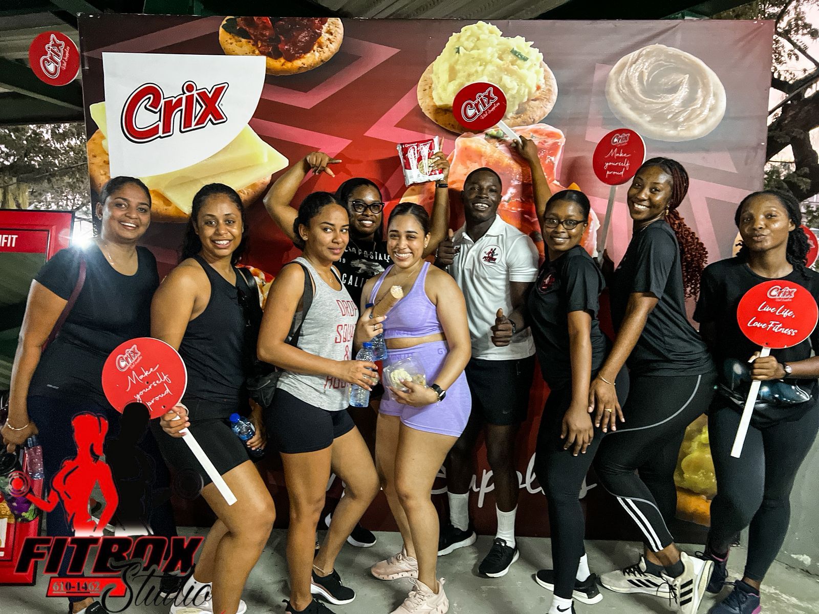 Fitbox group at a company event backdrop